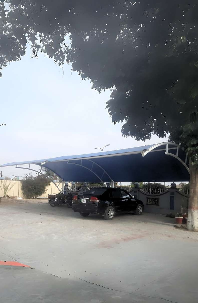 Durable tensile fabric car parking shade providing reliable outdoor protection for your vehicle from sun and weather elements.