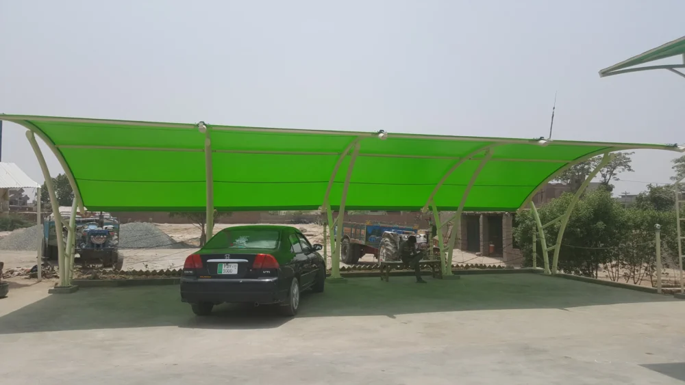 Durable car parking shade made with tensile fabric membrane, featuring a simple and modern design for outdoor vehicle protection.