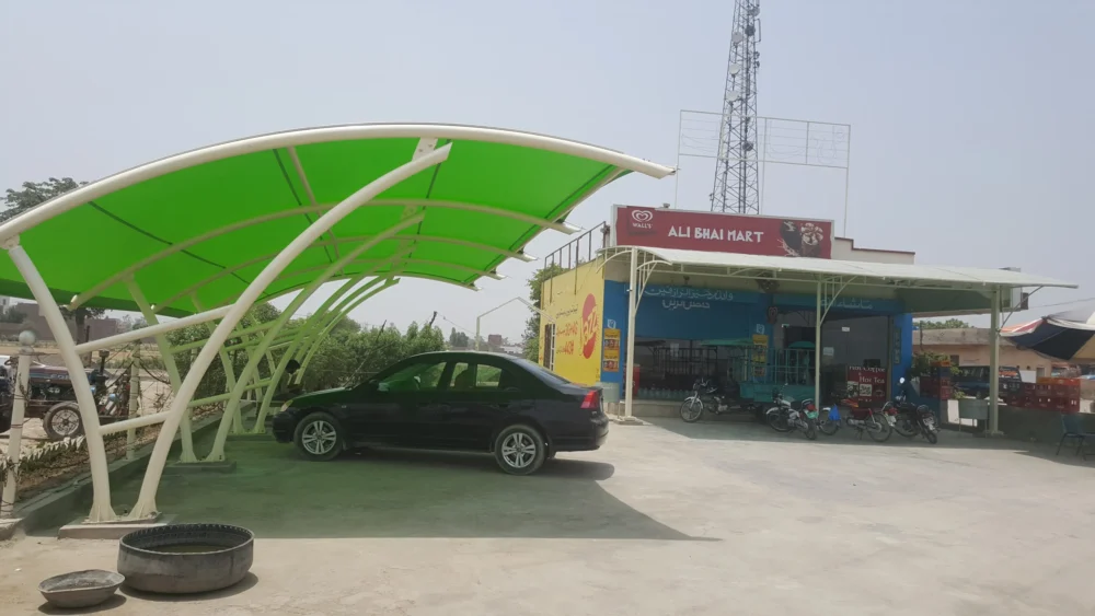 Durable car parking shade made with tensile fabric membrane, featuring a simple and modern design for outdoor vehicle protection.