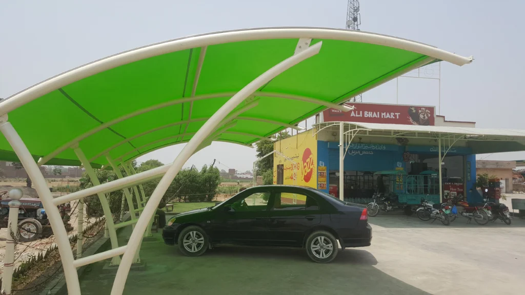 Durable car parking shade made with tensile fabric membrane, featuring a simple and modern design for outdoor vehicle protection.