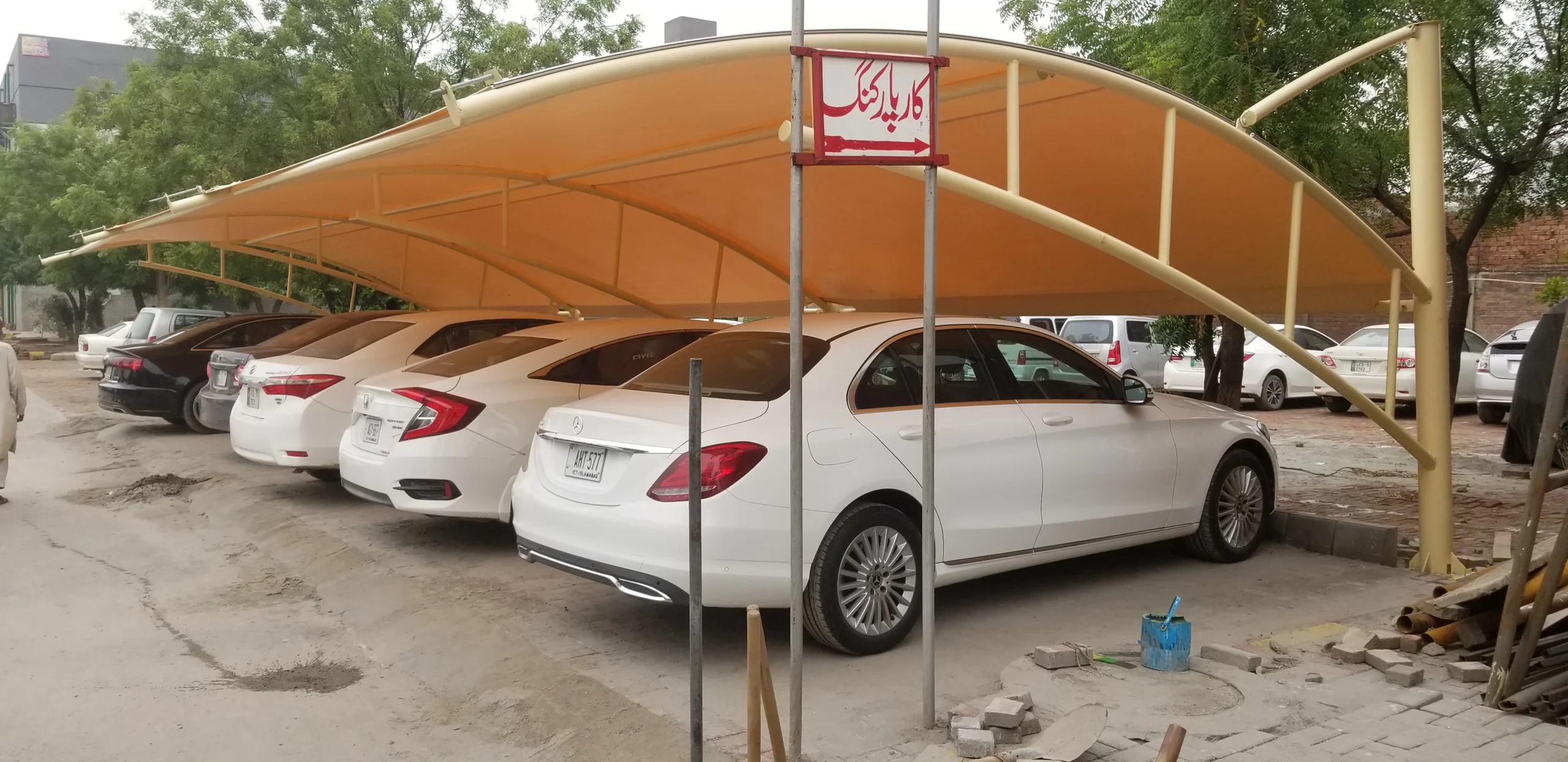 Car Parking Shades with tensile fabric, designed for homes and commercial spaces in Pakistan, offering reliable and stylish shading solutions.
