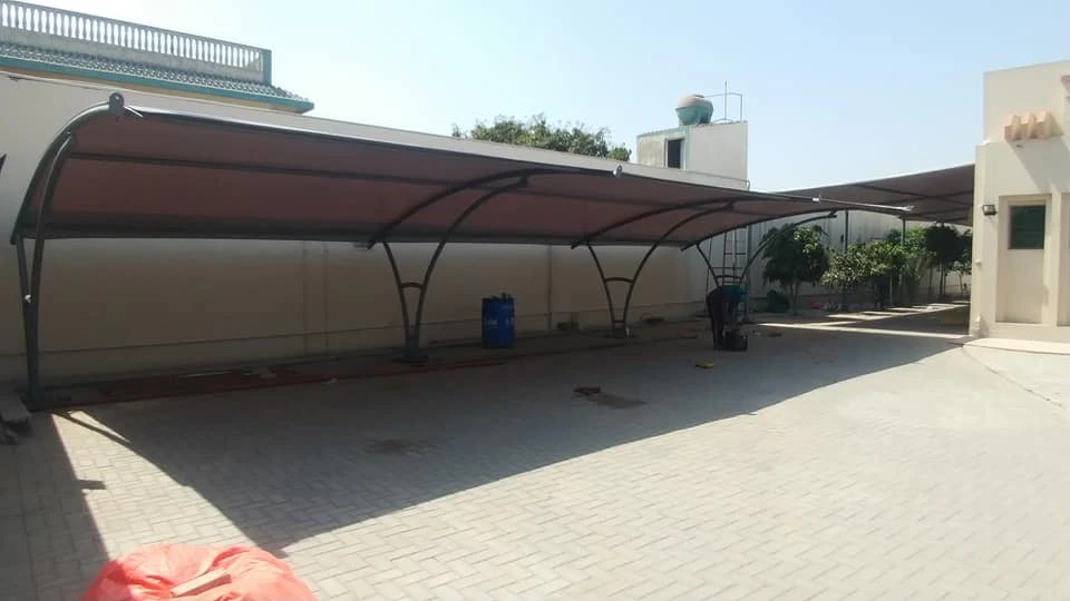 Modern and durable home car parking shade design providing stylish and practical shading solutions for residential spaces