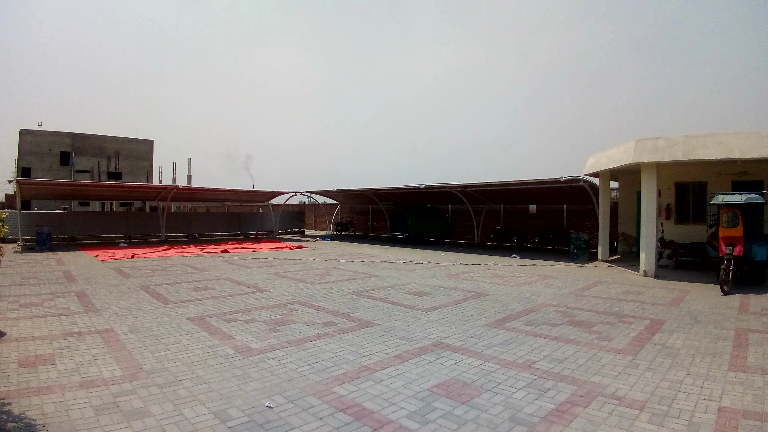 Modern parking shades offering stylish and weather-resistant solutions, designed to protect vehicles from sun and rain, perfect for homes and commercial spaces.