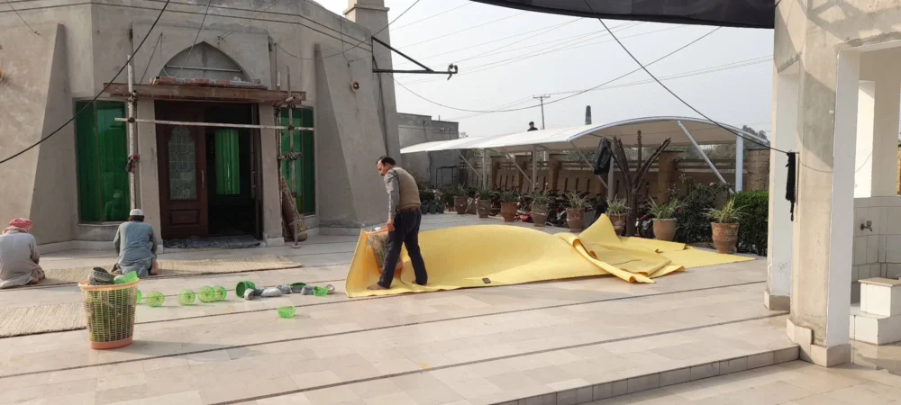 Motorcycle parking shade in Pakistan with tensile fabric top cover for optimal protection and durability.