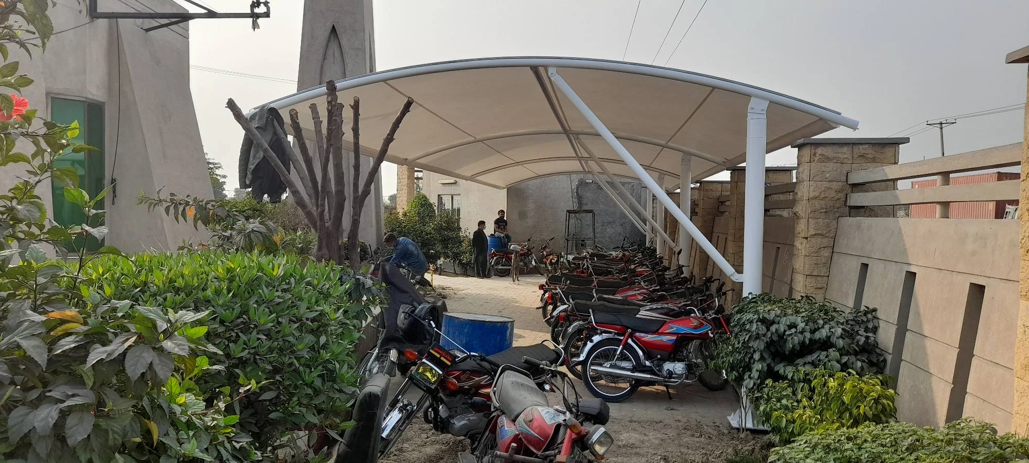 Motor Cycle Parkin Shade in Pakistan (2) Motorcycle parking shade in Pakistan with tensile fabric top cover for optimal protection and durability.