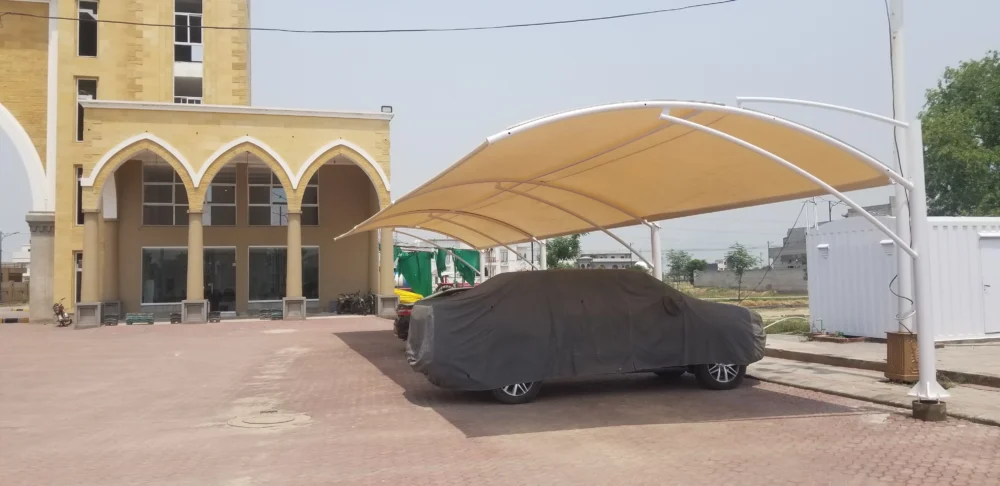 Durable tensile fabric outdoor car parking shade for effective sun and weather protection, ideal for homes and commercial spaces.