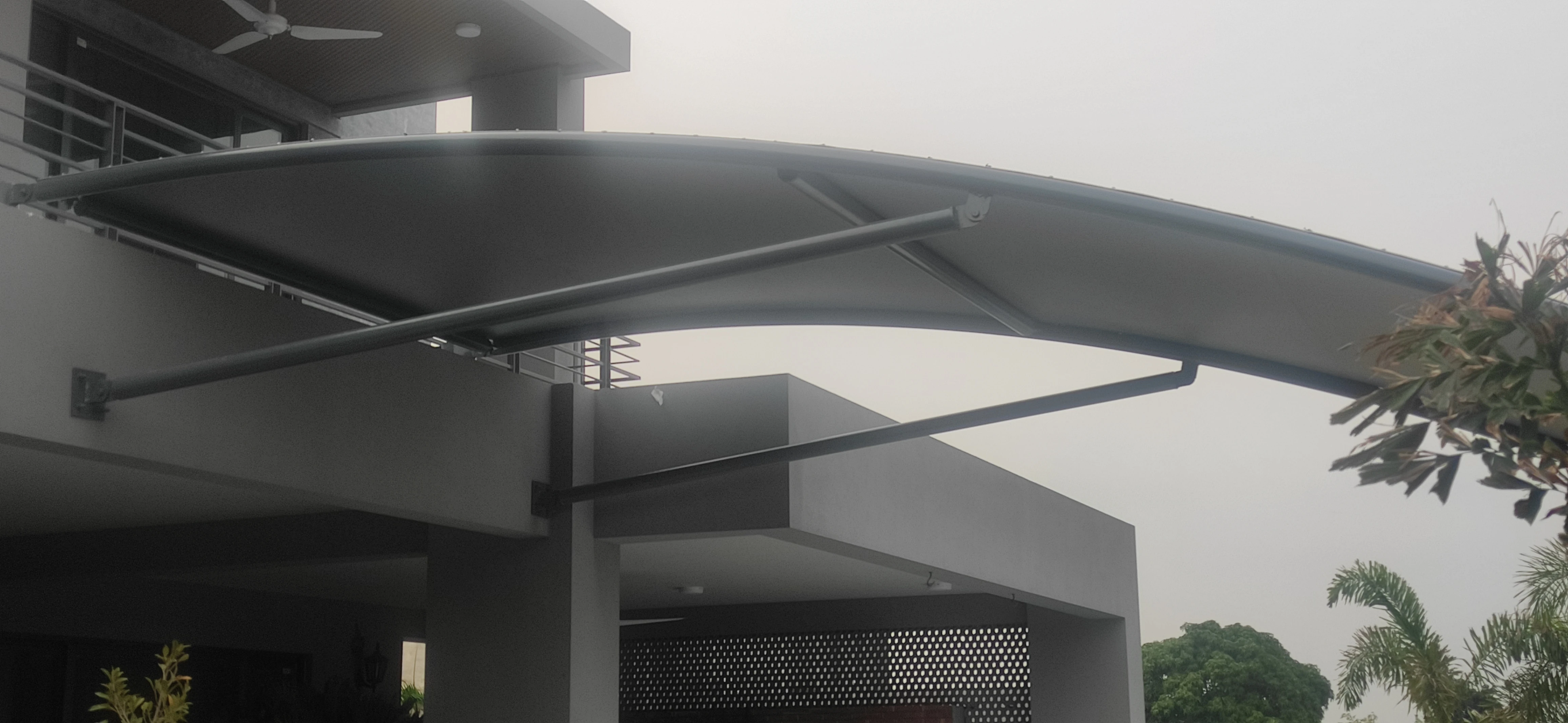 Garage Front Shade Expand Your Parking Space (1) Tensile fabric garage front shade expands the parking space with durable and stylish protection.