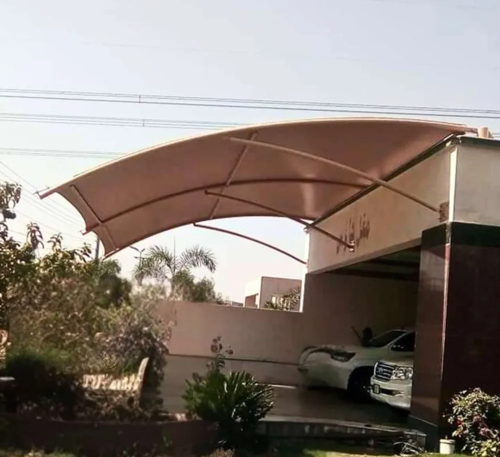 Wall-mounted tensile fabric home car parking shade without pillars provides stylish and durable shading solutions for residential spaces.