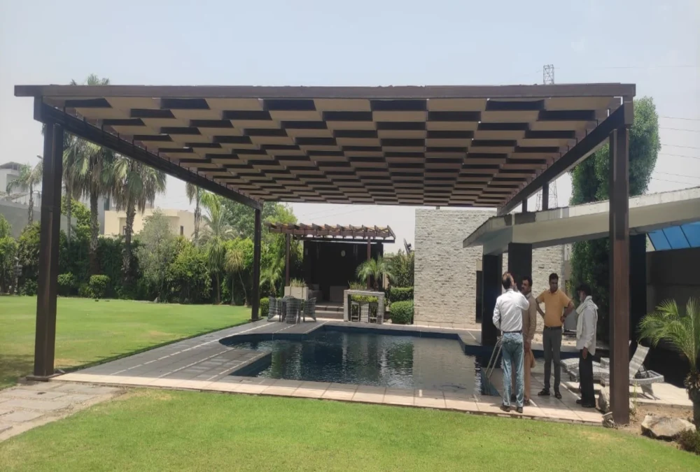 A modern pool pergola shade design featuring a stylish and durable structure, providing UV protection and enhancing outdoor aesthetics for swimming pool areas.