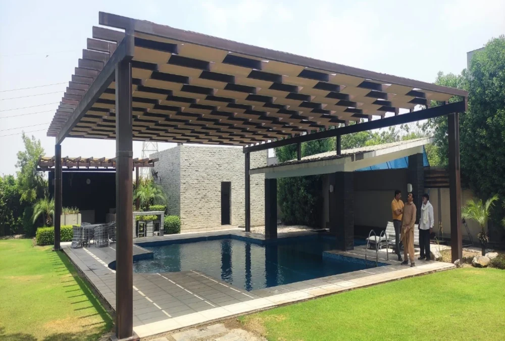 A modern pool pergola shade design featuring a stylish and durable structure, providing UV protection and enhancing outdoor aesthetics for swimming pool areas.