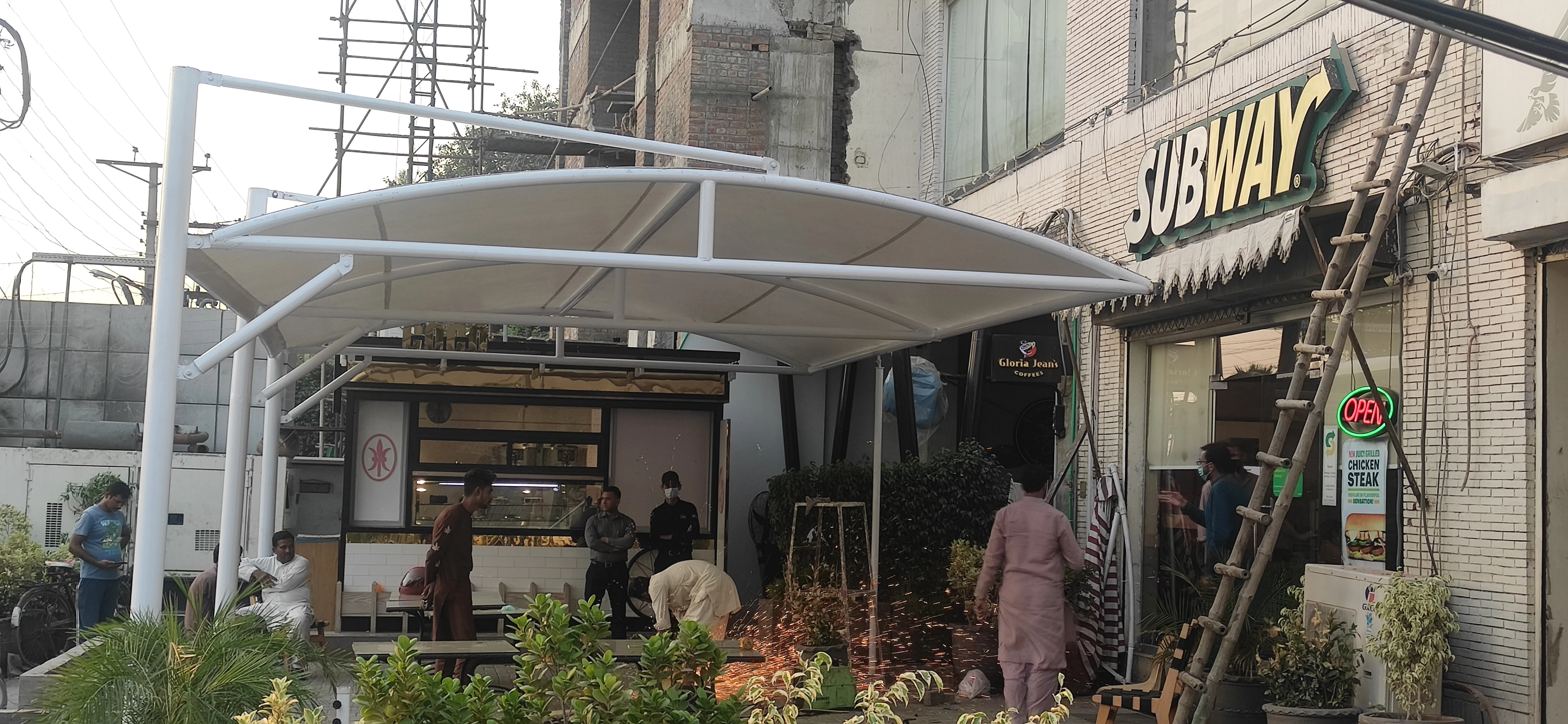 Outdoor shades for cafés in Pakistan provide stylish and durable shading solutions for patios, terraces, and outdoor seating areas.