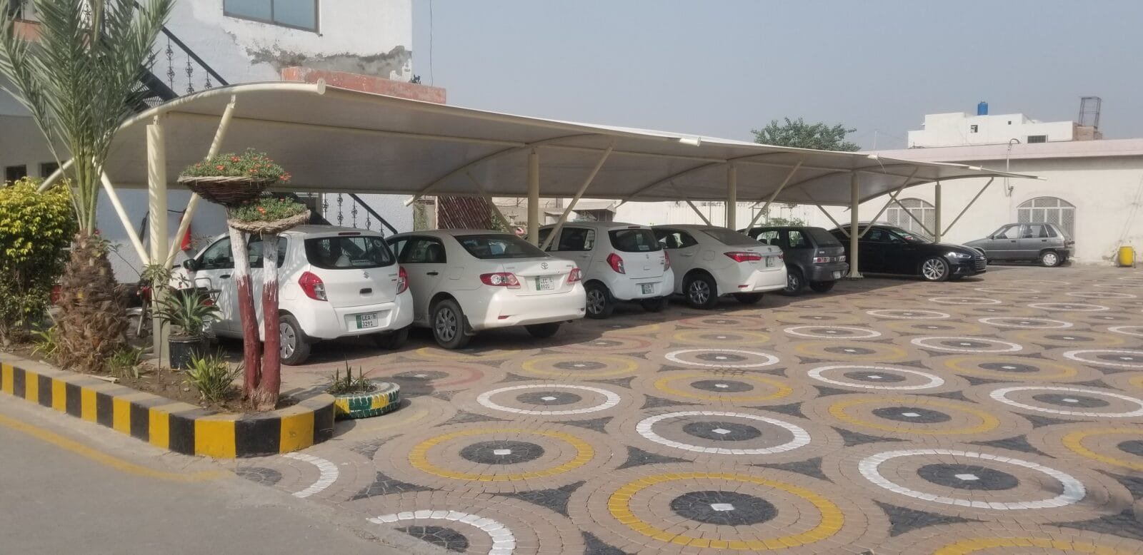 Car shed price in Pakistan with affordable and custom options from Covers and Shades, including tensile fabric and steel structures.