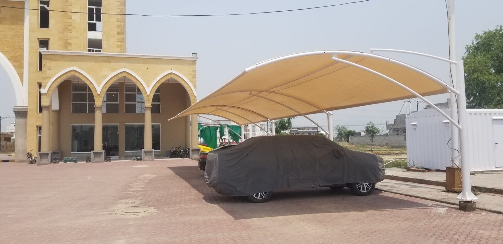 Car shed price in Pakistan with affordable and custom options from Covers and Shades, including tensile fabric and steel structures.