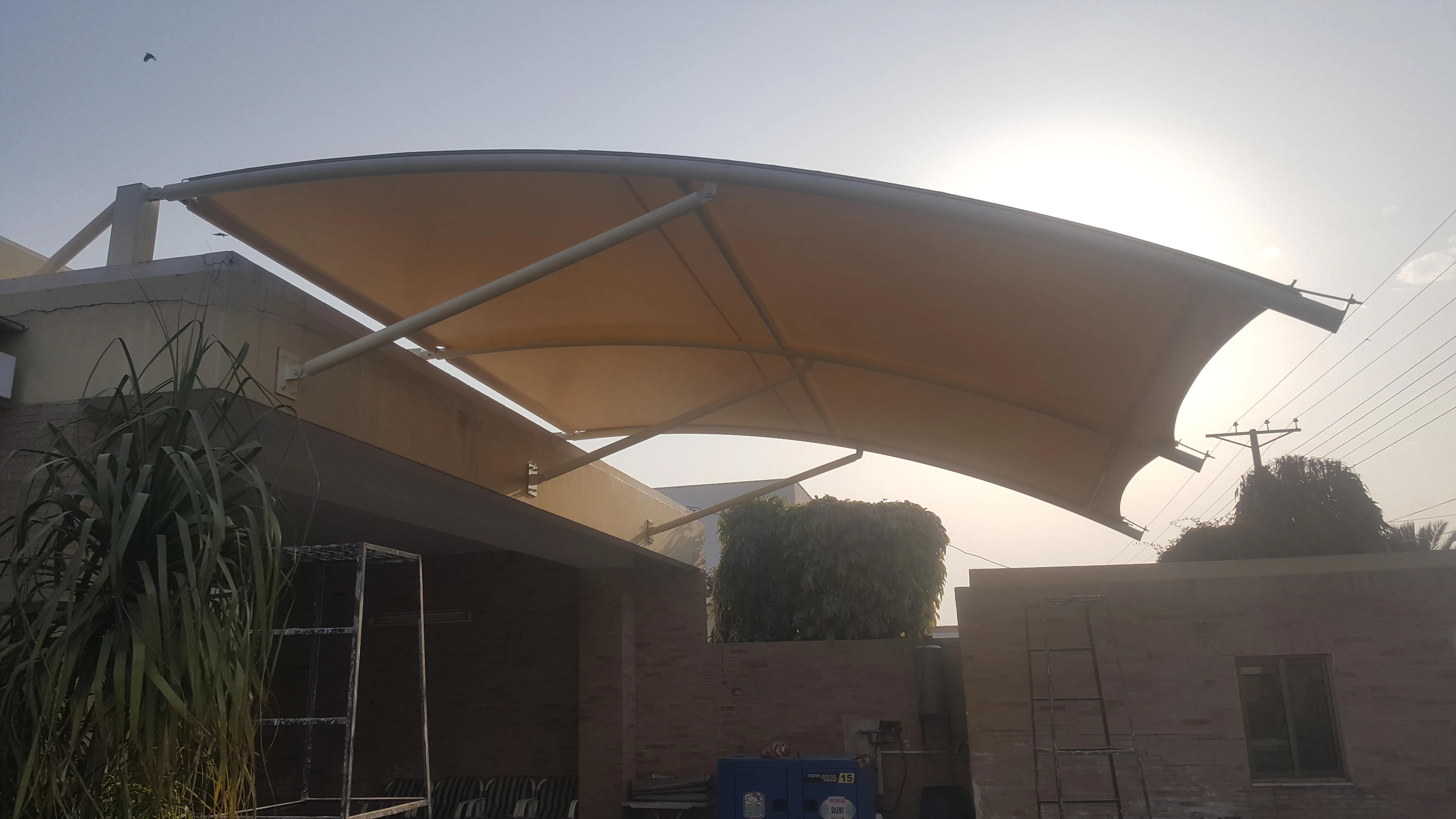 Modern shade design for home in Pakistan – Stylish and space-saving outdoor shading solutions for car parking, patios, and gardens.