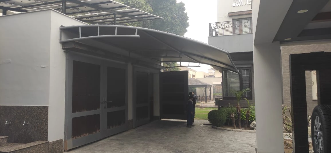 Durable tensile fabric carport garage shades offer all-weather vehicle protection, UV resistance, waterproof coverage, and a modern design.