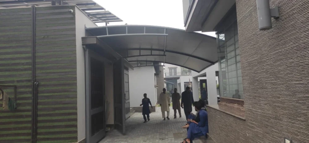 Durable tensile fabric carport garage shades offer all-weather vehicle protection, UV resistance, waterproof coverage, and a modern design.
