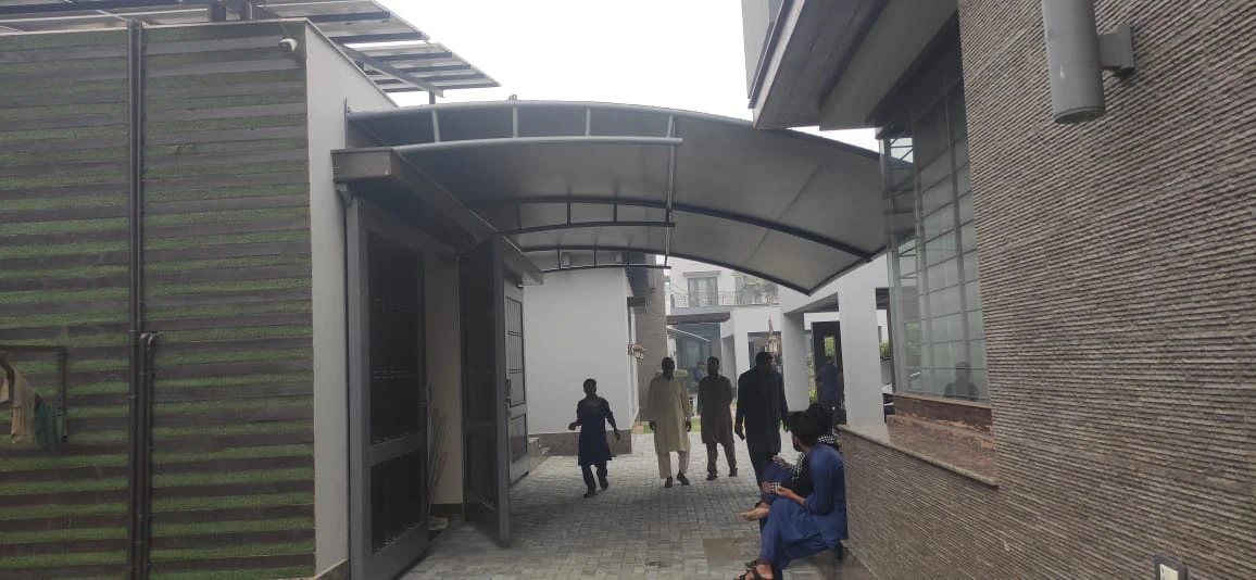 Durable tensile fabric carport garage shades offer all-weather vehicle protection, UV resistance, waterproof coverage, and a modern design.