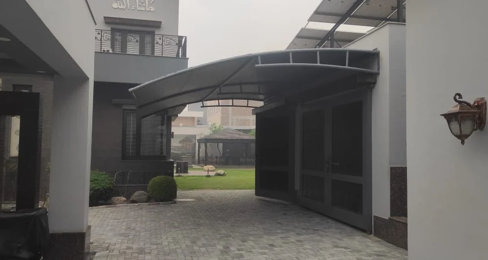 Durable tensile fabric carport garage shades offer all-weather vehicle protection, UV resistance, waterproof coverage, and a modern design.