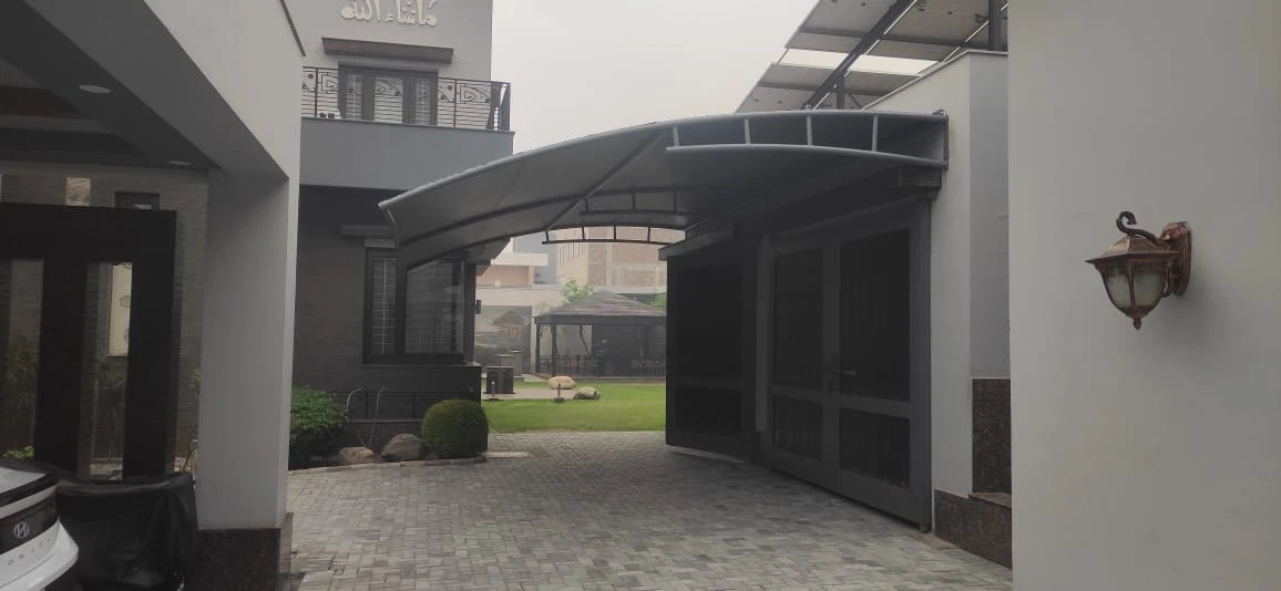 Durable tensile fabric carport garage shades offer all-weather vehicle protection, UV resistance, waterproof coverage, and a modern design.