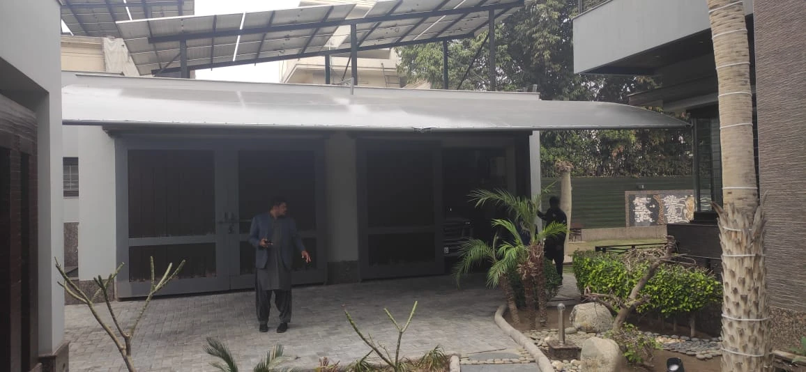 Durable tensile fabric carport garage shades offer all-weather vehicle protection, UV resistance, waterproof coverage, and a modern design.