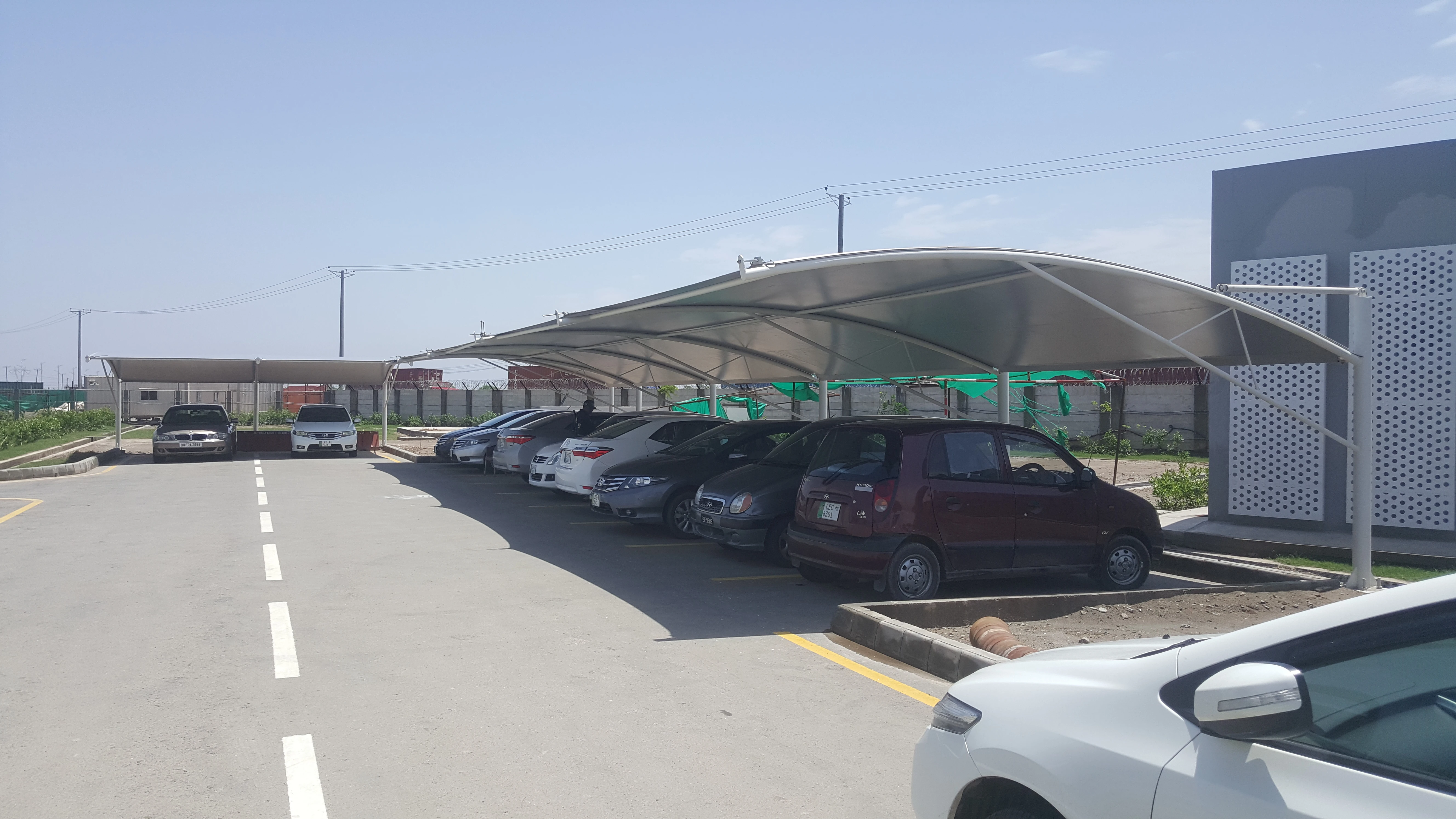 Modern tensile parking shades price details and designs for homes and businesses in Pakistan.