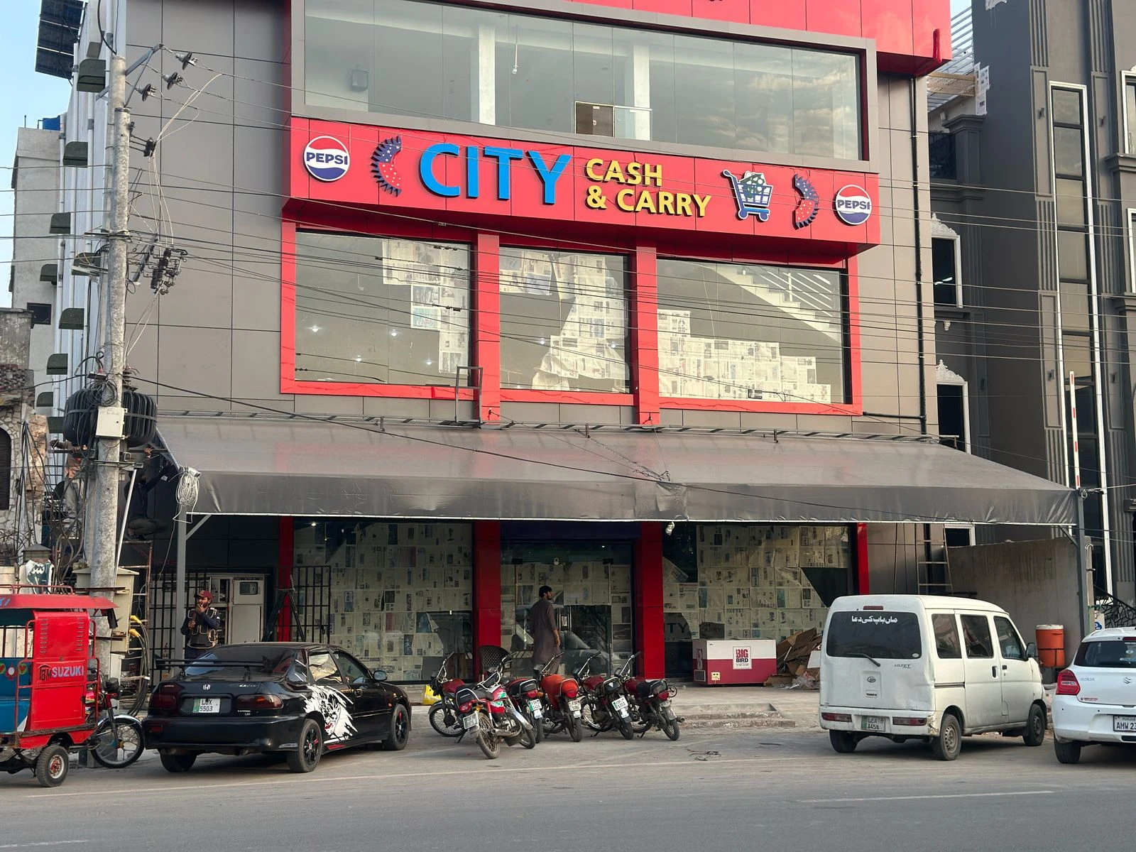 Durable tensile fabric shades for car parking and outdoor spaces, providing UV protection and modern design