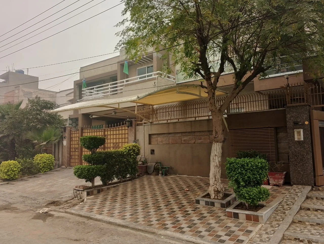 Tensile Parking Shed Custom Car Shade Solutions in Pakistan (1) Tensile parking shed for cars – custom shade solution in Pakistan for residential and commercial use by Covers and Shades.