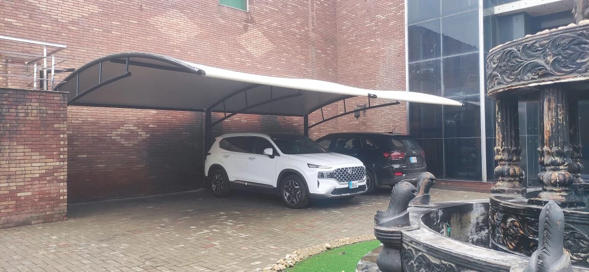 Buy tensile car parking shade in Faisalabad – weatherproof and UV-protected shade structure for home or commercial use